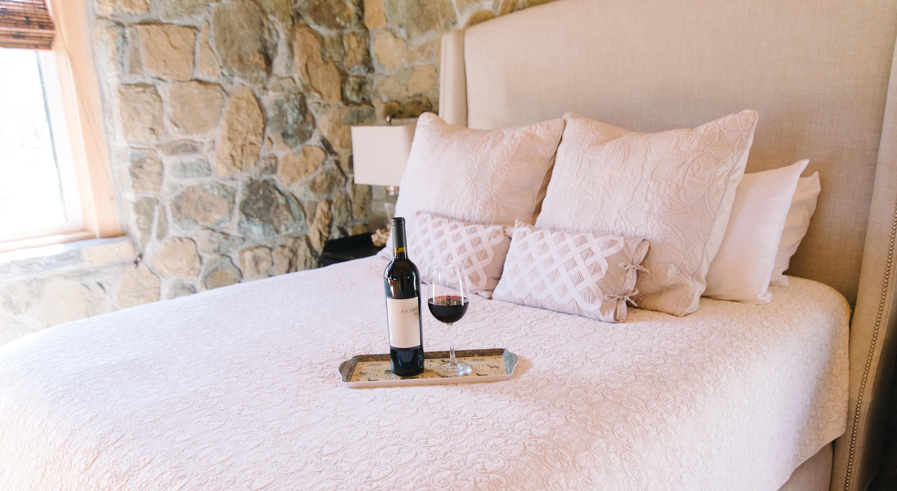 Bed with Ascent Red Wine in Stone Cottage