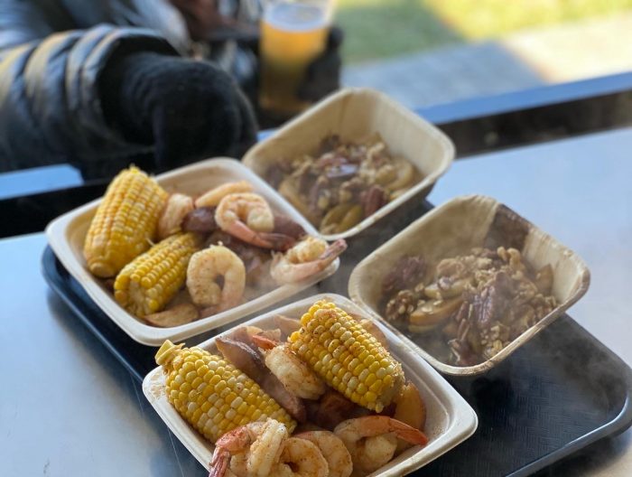 5th annual Low Country Boil guest enjoying a plate at Dirt Farm Brewing loudoun county brewery