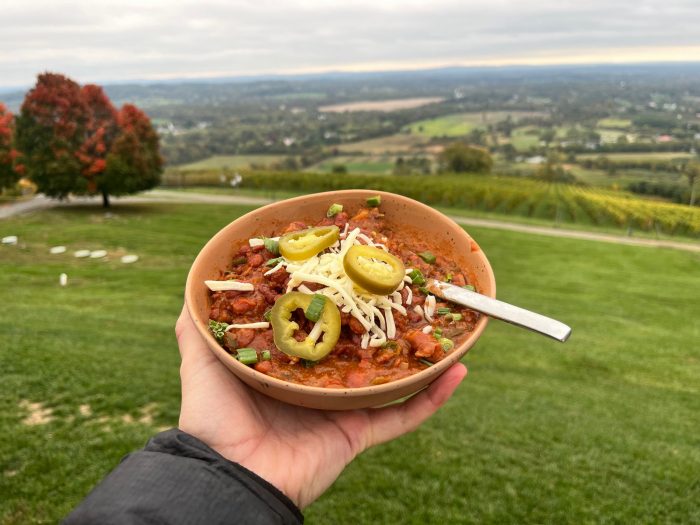A bowl of chili posed at dirt farm brewing facing the loudoun valley