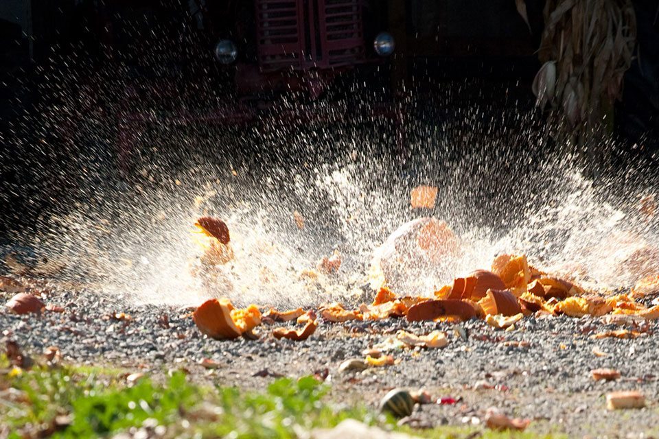 Pumpkin chunkin' event photo of a pumpkin being smashed to the ground