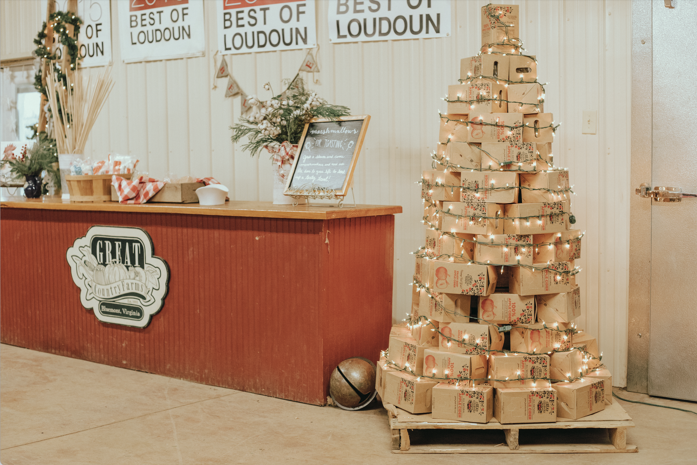 Christmas market main image - stacked apple cider boxes to make Christmas tree