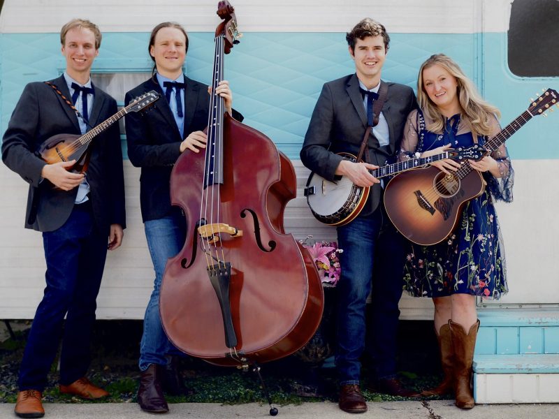 live music with karma creak, band posing with their instruments before a show at dirt farm brewing