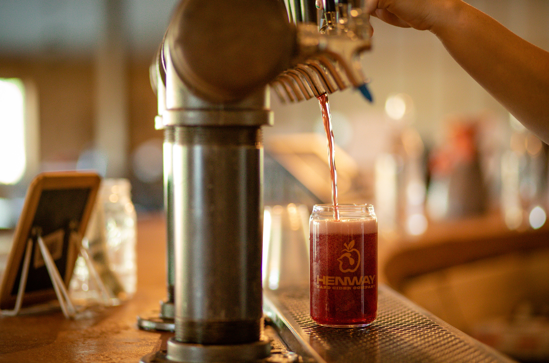 Blackberry Ginger Cider Release main image of a cider tap pouring into a Henway Hard Cider Company Glass