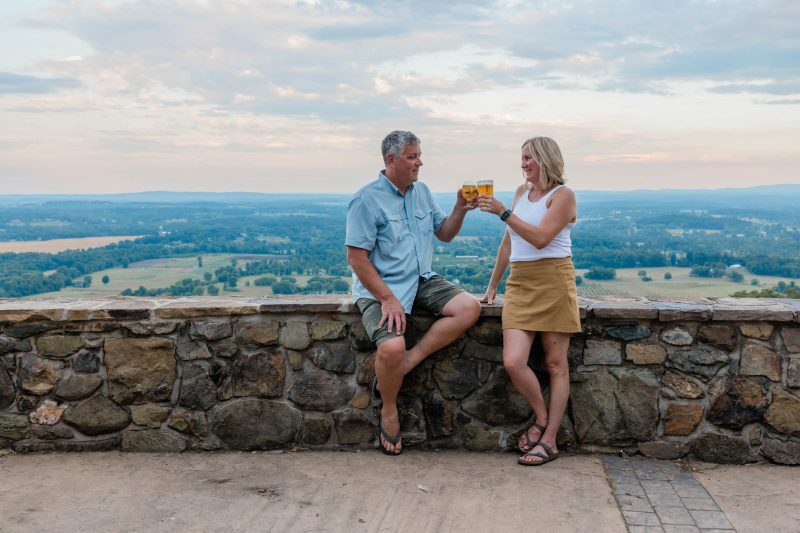 Dirt Farm Brewing Owners Bruce and Janell Zurschmeide cheers a beer after the founders tour and tasting in Loudoun county, virginia
