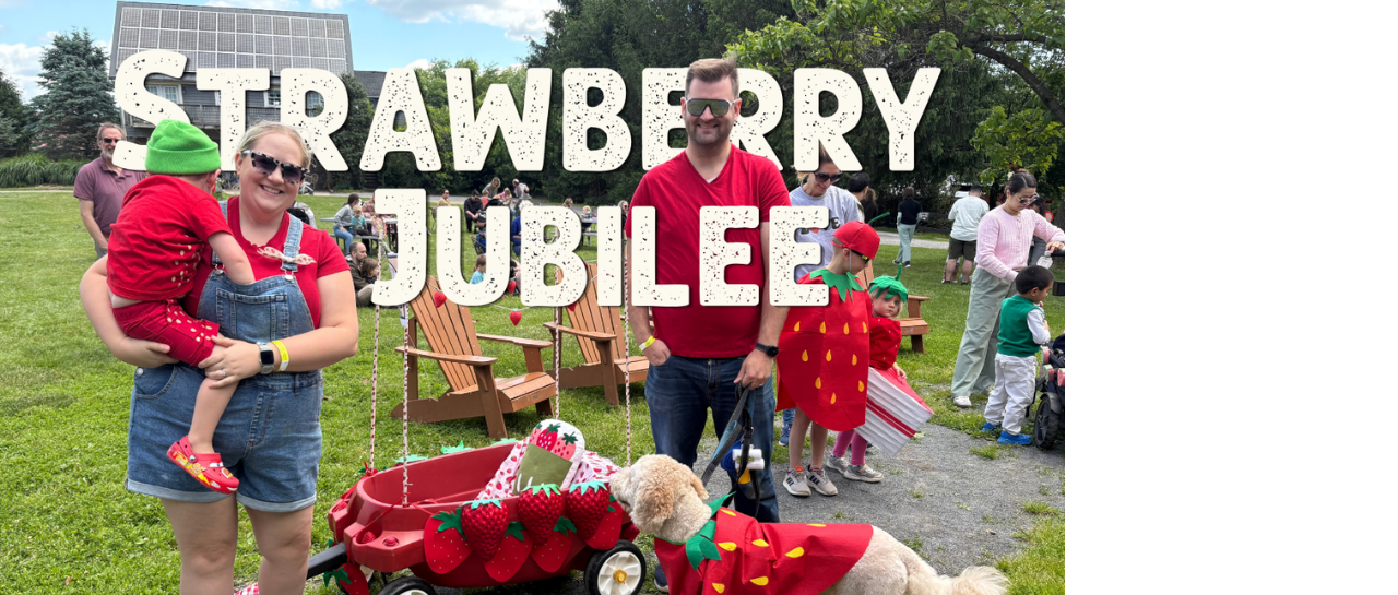 Strawberry Jubilee Fest image of family dressed in red with a red wagon decorated with 3D printed strawberries